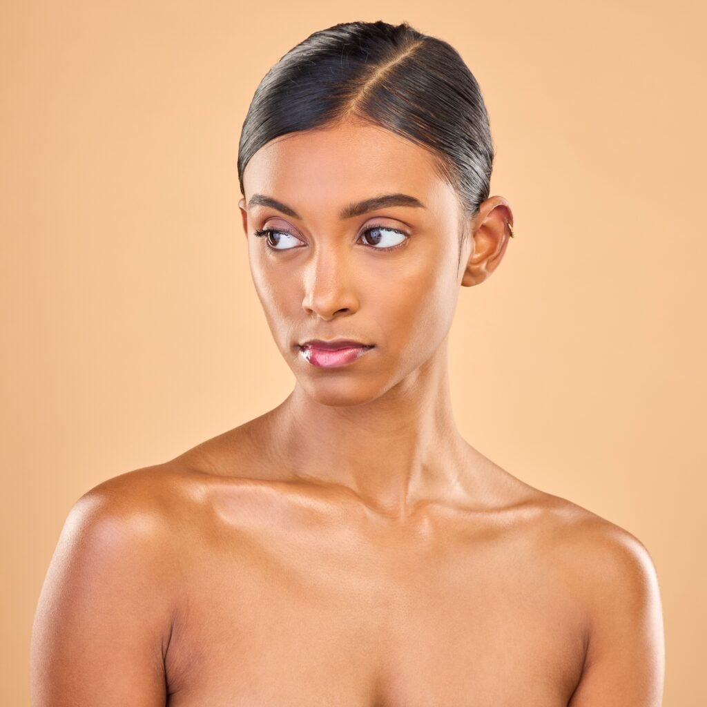 Beauty, face and skin of woman serious in studio for skincare, cosmetics, dermatology or makeup. Ae