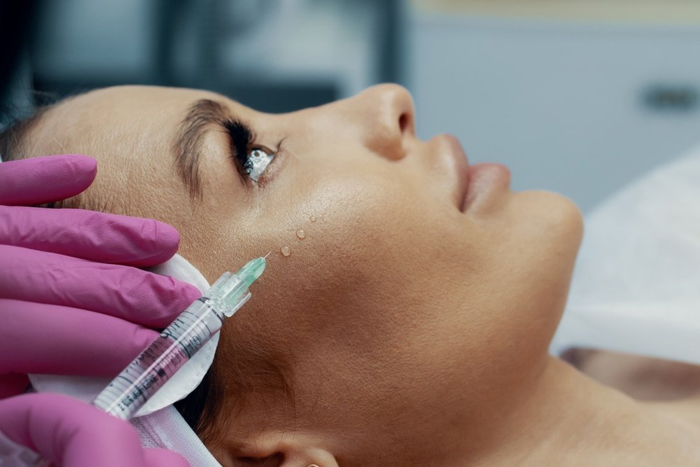 Focus,On,Beautician,Hand,In,Glove,Holding,Syringe,With,Hyaluronic