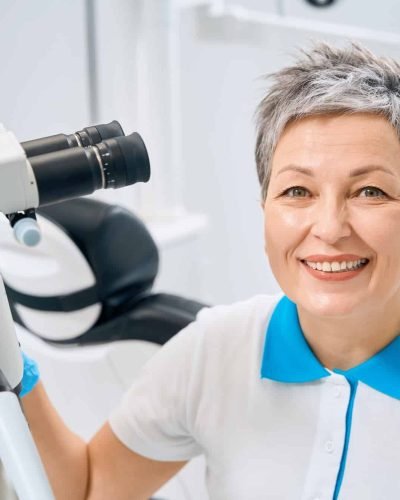 Dental and aesthetic practitioner working on professional medical equipment