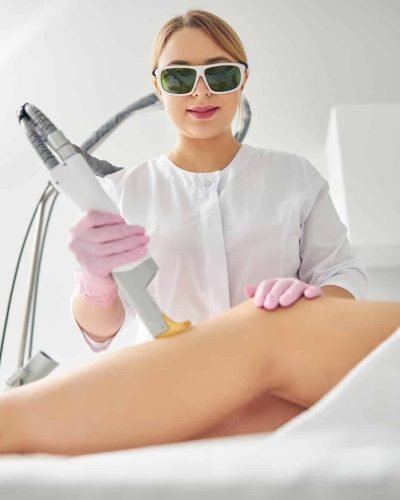 Focused doctor carrying out a cosmetic procedure